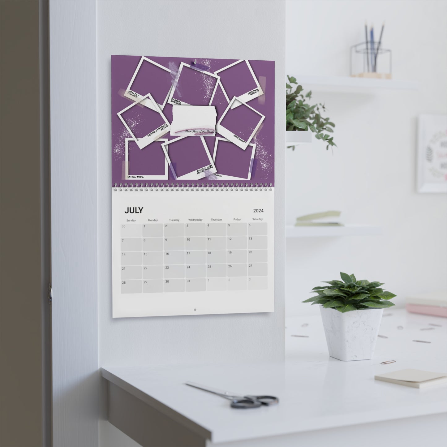 purple 2024 Iconic Manifestation Standard Wall Calendar hanging in all white office