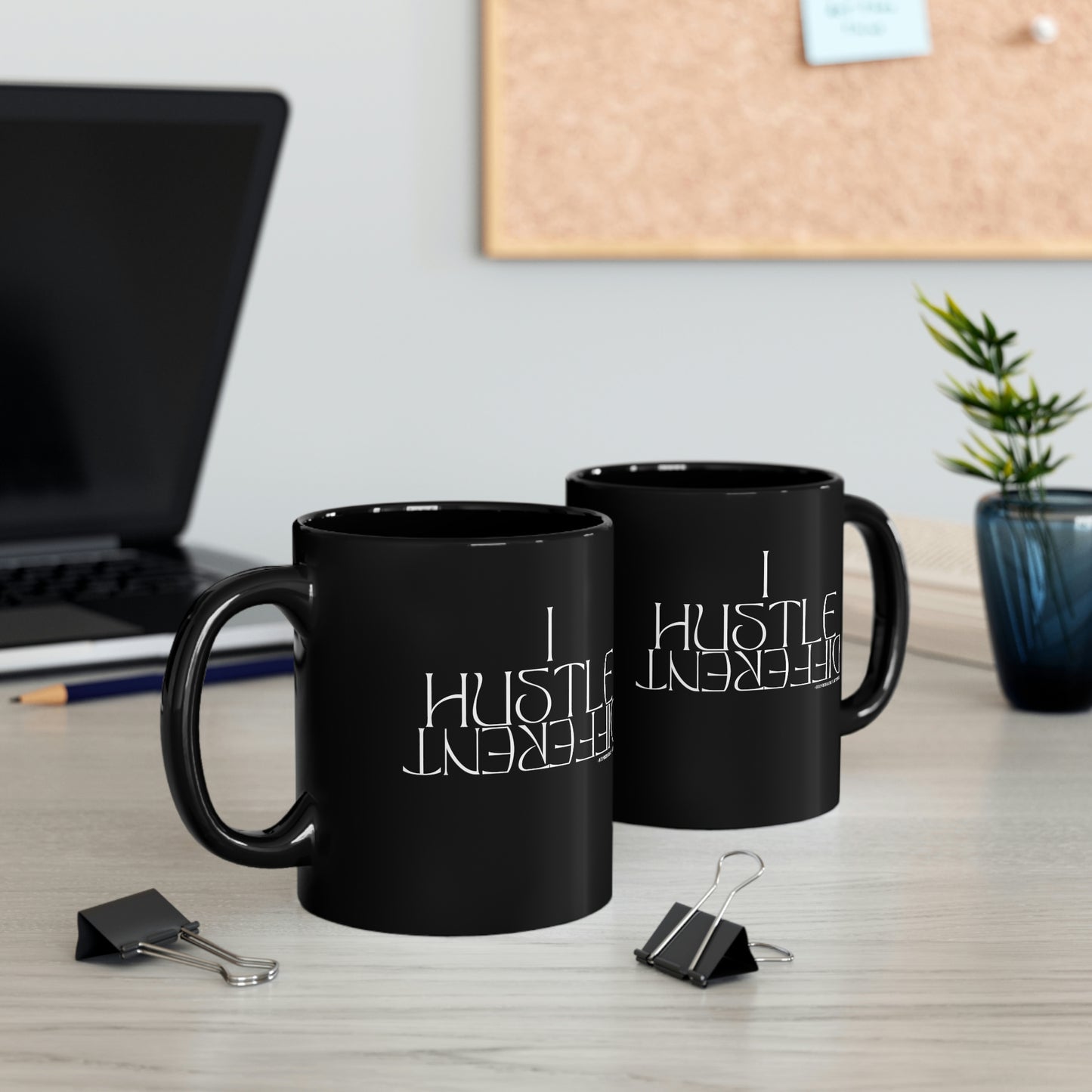 two "I Hustle Different" Mugs sitting on computer desk 