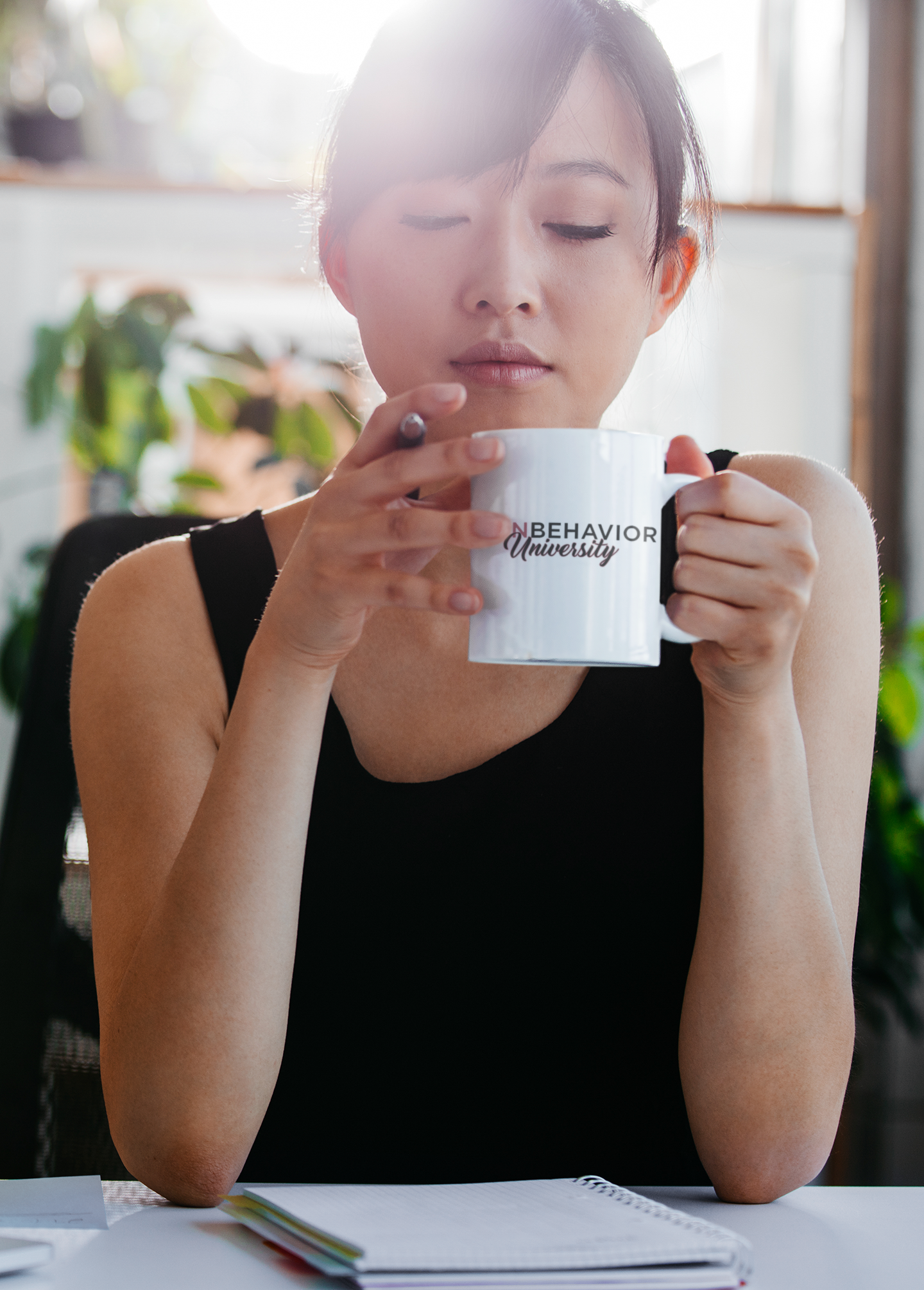 Girl Boss holding a Icon Behavior University Signature Mug