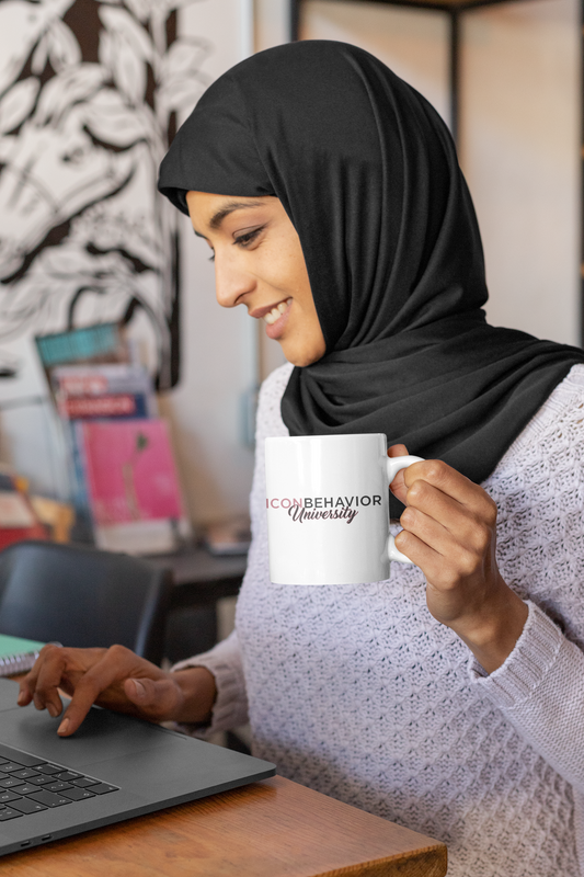 Women Entrepreneur wearing hijab holding a Icon Behavior University Signature Mug