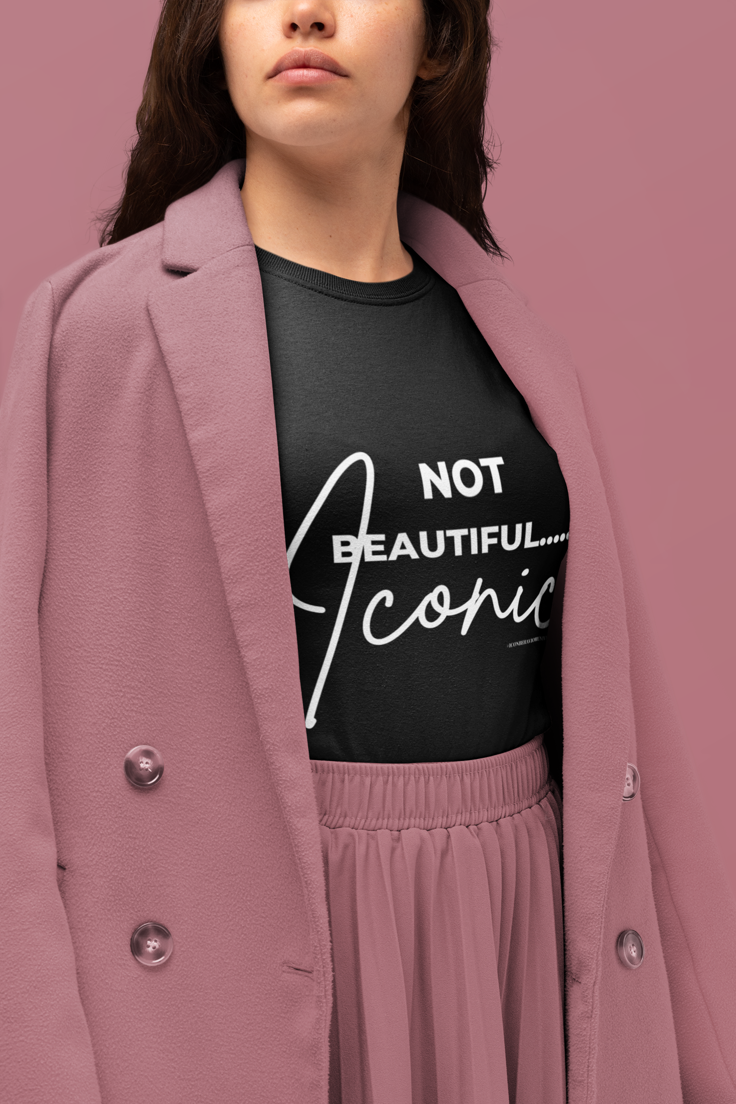 women in black Not Beautiful... Iconic T-Shirt and pale pink business suite 